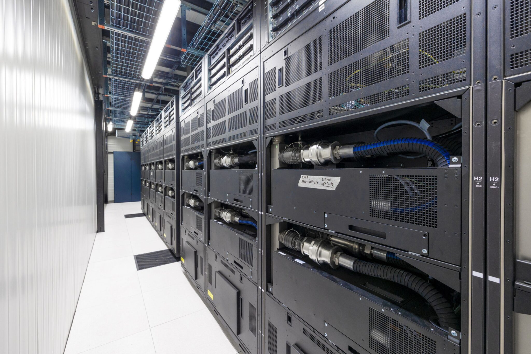 View of the rear of JUPITER booster racks, with warm water cooling.